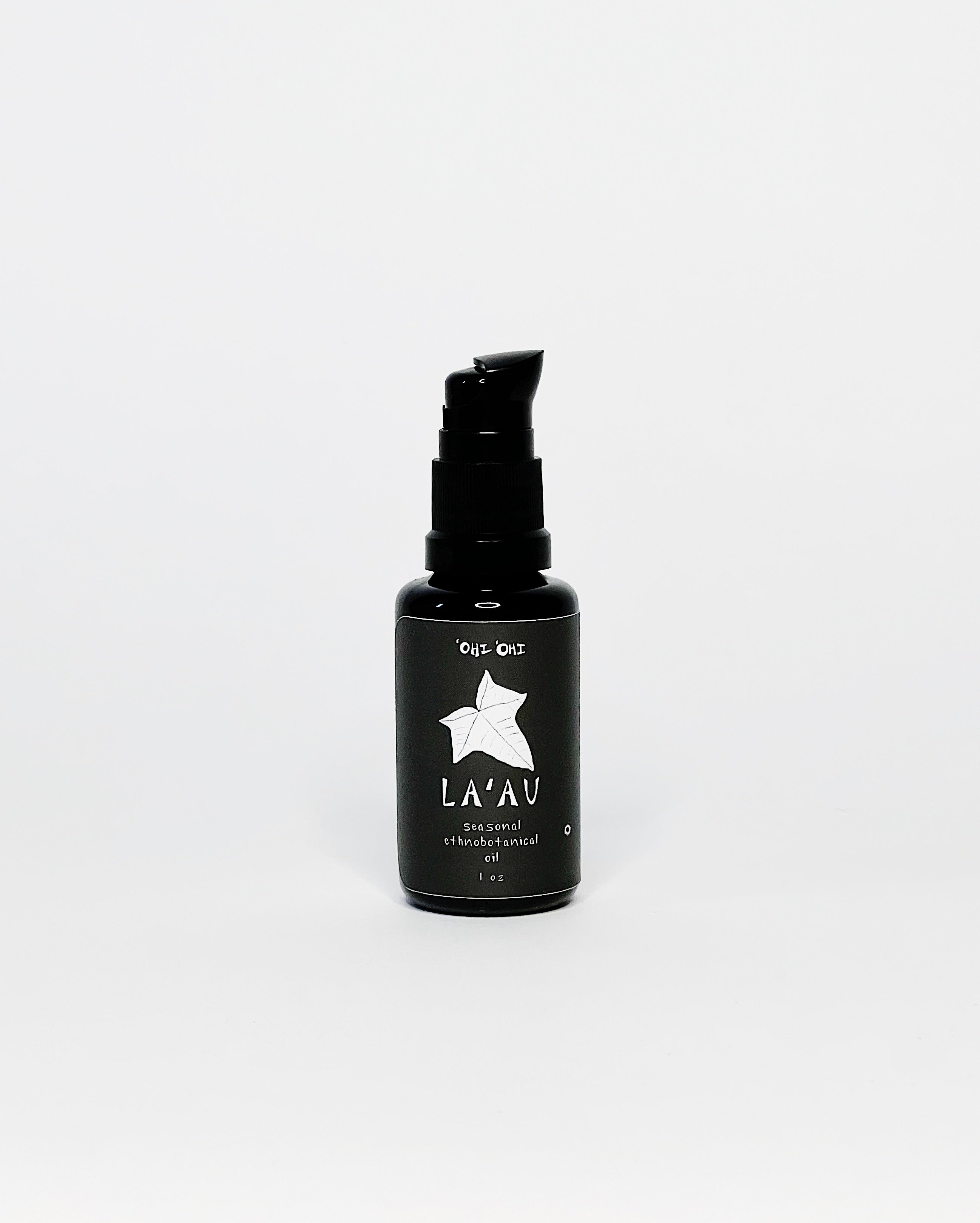 Black glass bottle of ʻOhi ʻOhi La‘au Seasonal Ethnobotanical Oil with a pump top, featuring a white leaf illustration and minimalist label on a white background