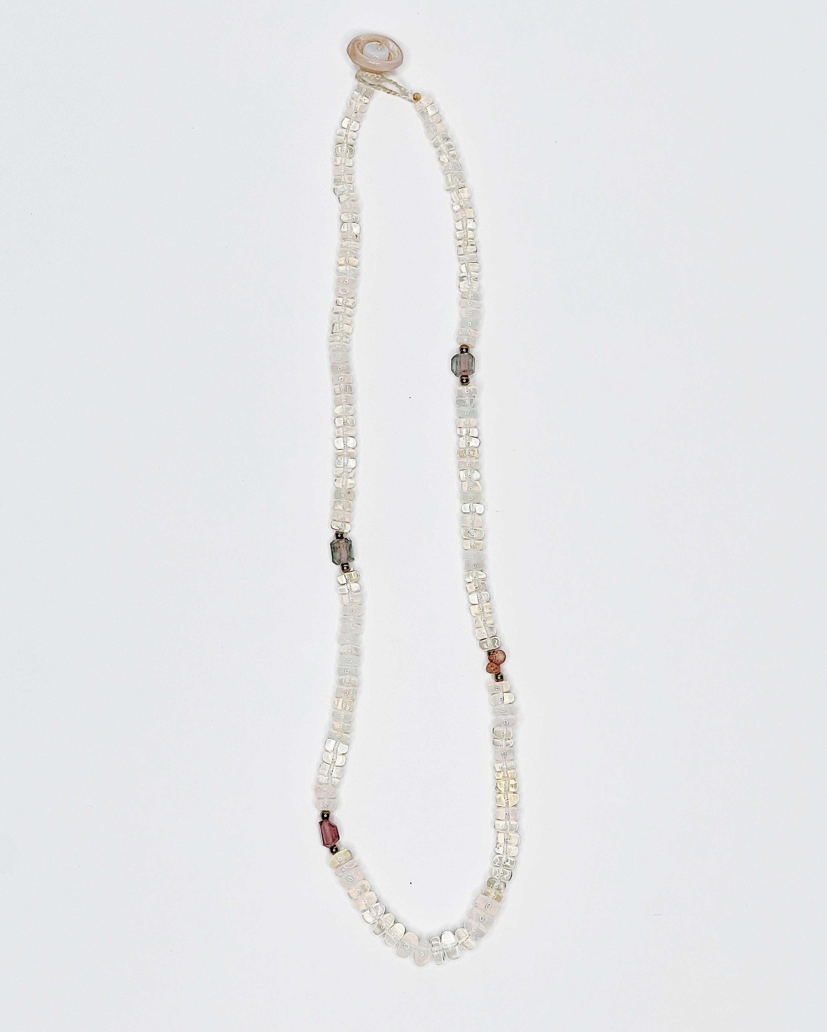 Handmade opal choker with colorful tourmaline accents, puka shell clasp, white background