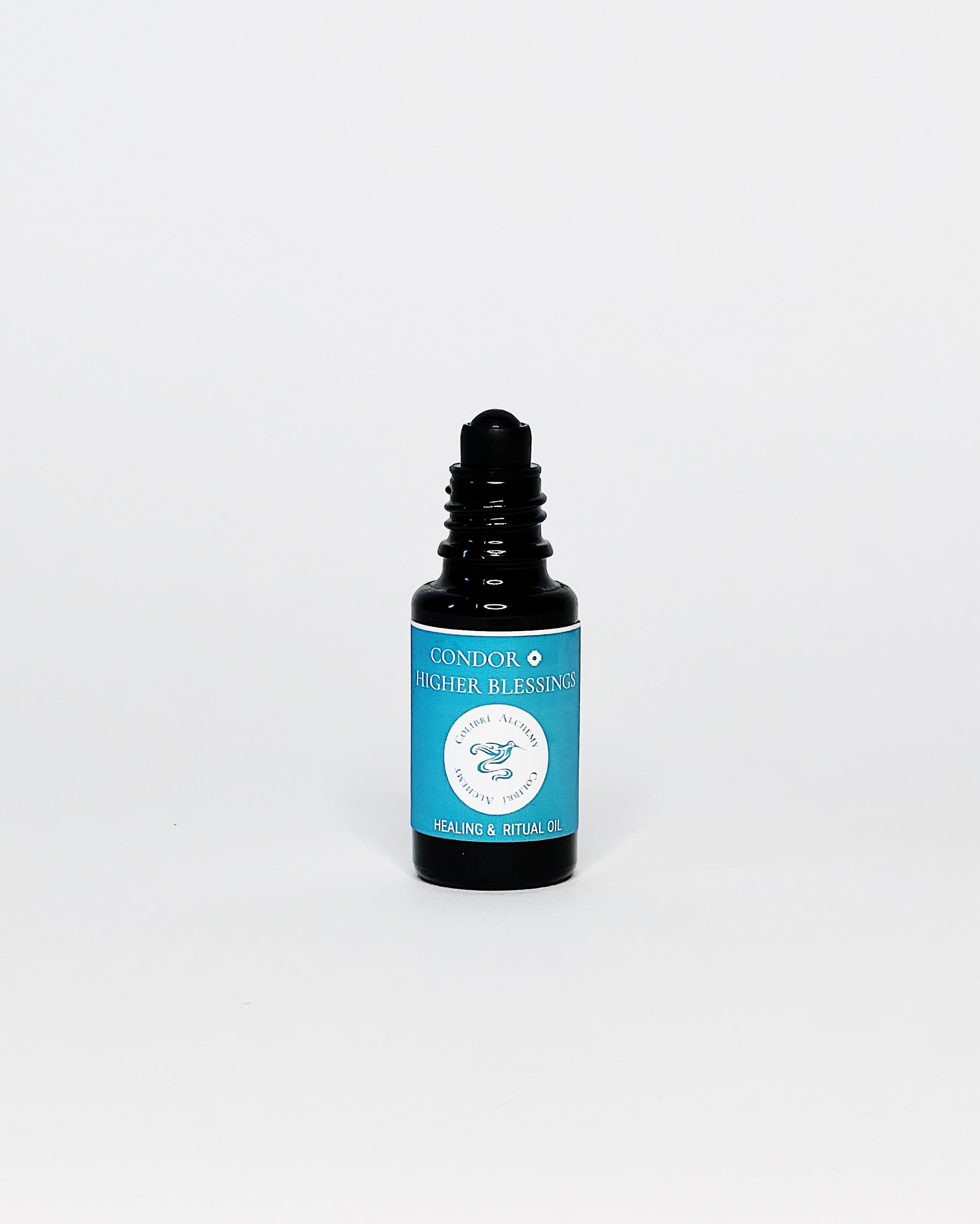 Condor Ritual Oil by Colibrí Alchemy in a dark glass bottle with blue label, promoting ease, equanimity, and healing.