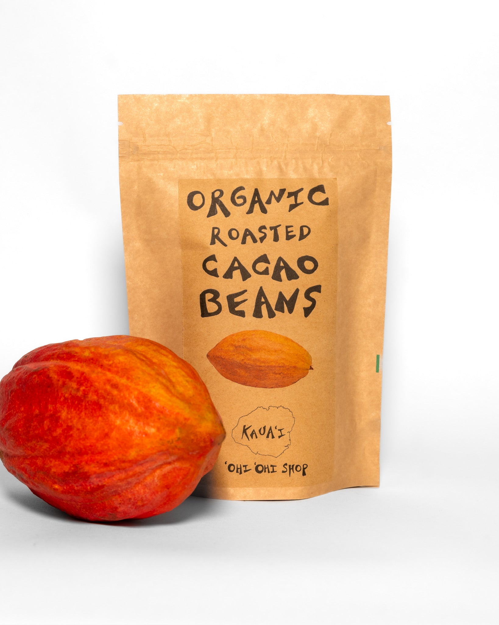 Brown kraft pouch labeled “Organic Roasted Cacao Beans” with an illustration of a cacao pod, from ‘Ohi ‘Ohi Shop on Kaua‘i.