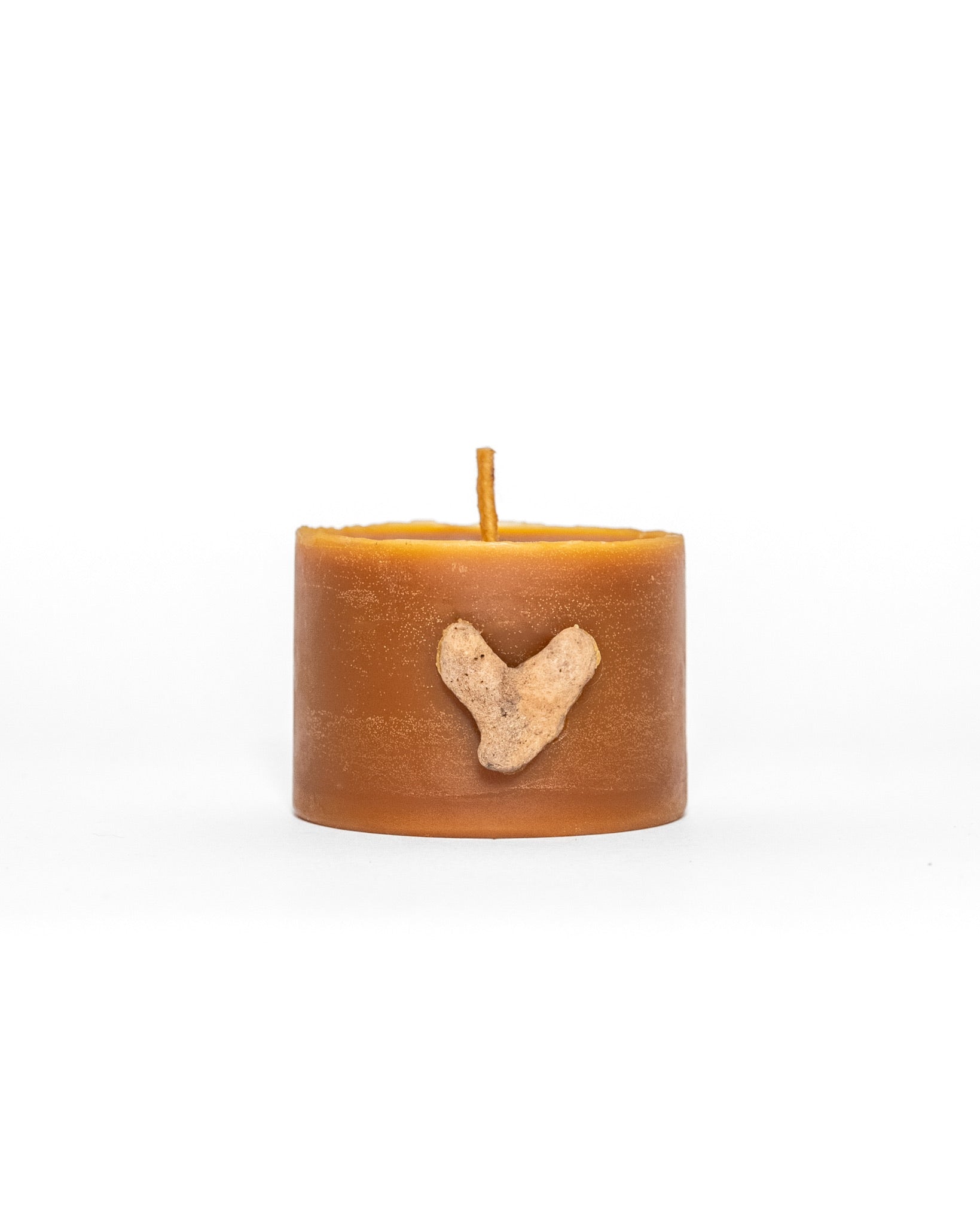 100% Hawaiian Beeswax Candle & Kaua'i Coral Heart. White background.