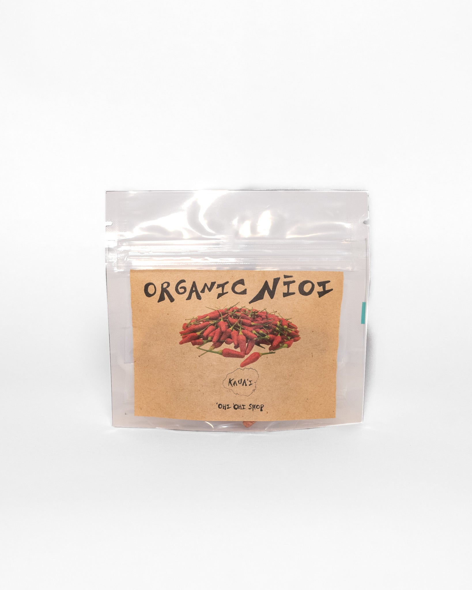 Clear pouch labeled “Organic nioi” with an illustration of Hawaiian chili peppers, from ‘Ohi ‘Ohi Shop on Kaua‘i.