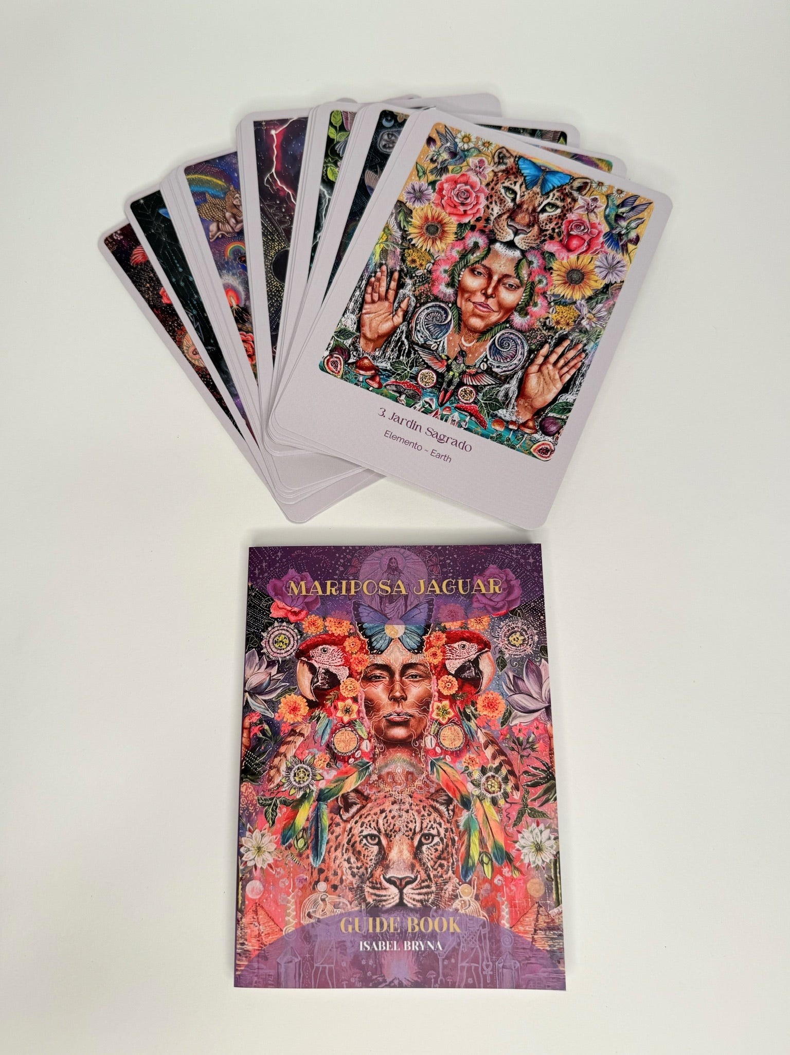 Colorful tarot cards with a guidebook on a white background